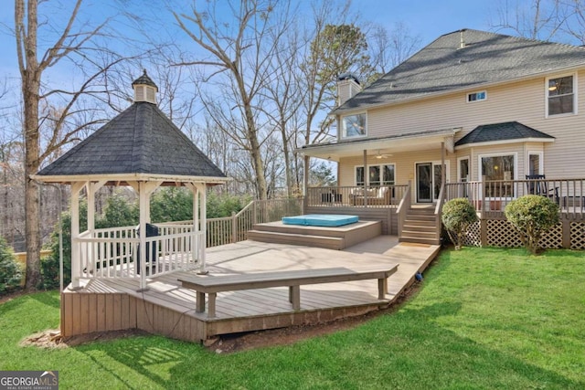 deck featuring a yard and a gazebo