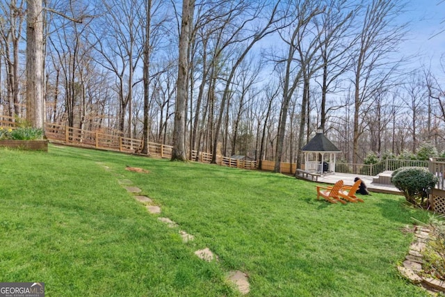 view of yard with a wooden deck