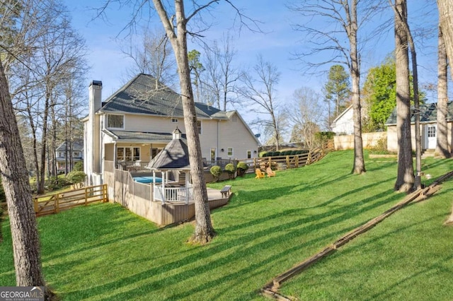 view of yard featuring a wooden deck