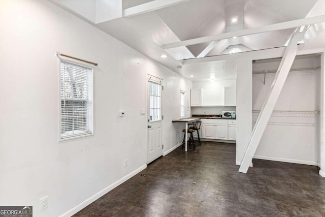 entryway with vaulted ceiling and a wealth of natural light