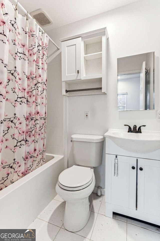 full bathroom with vanity, toilet, shower / tub combo, and tile patterned flooring