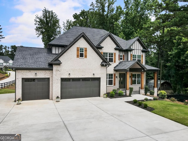 view of front of house with a front yard and a garage