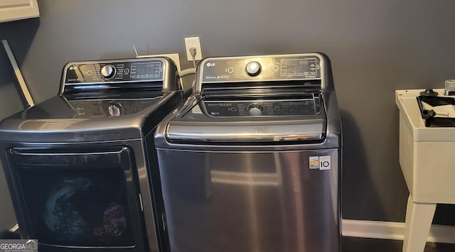 washroom featuring independent washer and dryer