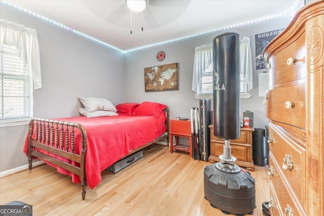 bedroom featuring hardwood / wood-style floors and ceiling fan