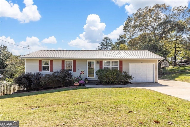 ranch-style house featuring a garage and a front lawn