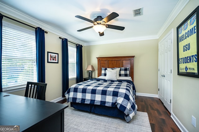 bedroom with ornamental molding, ceiling fan, and dark hardwood / wood-style flooring