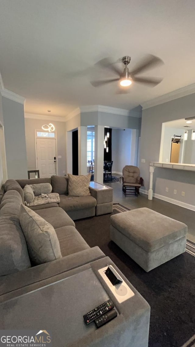 living room featuring ceiling fan and ornamental molding