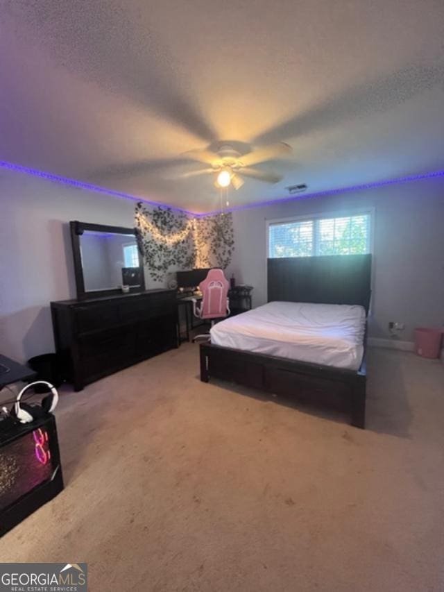 bedroom featuring carpet floors and ceiling fan