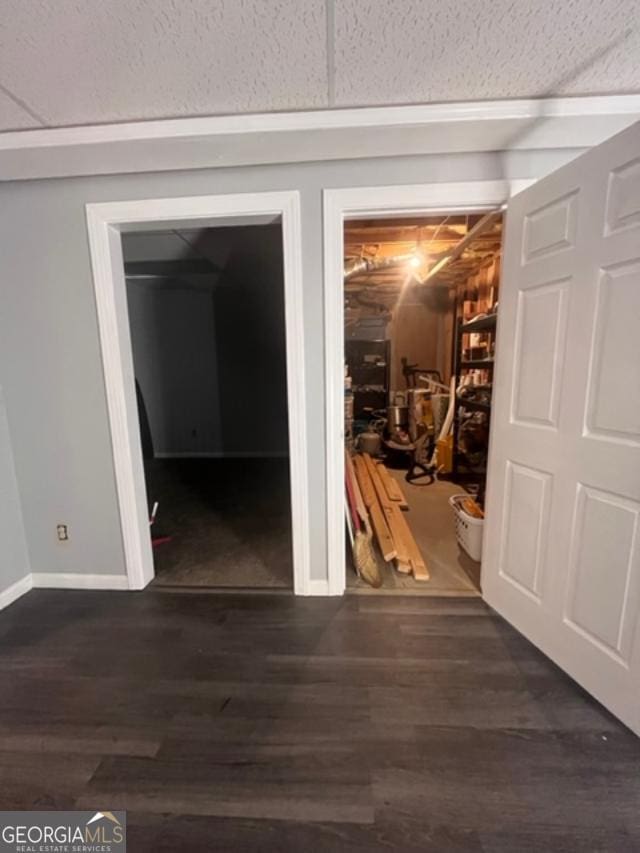 corridor with dark hardwood / wood-style floors