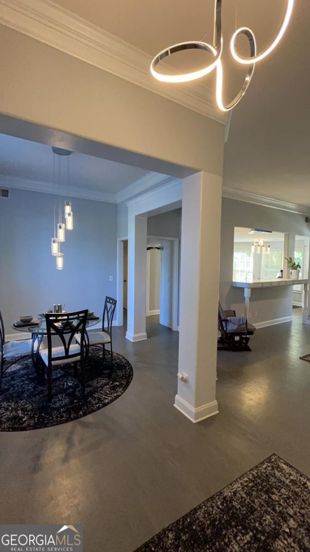 dining room featuring crown molding