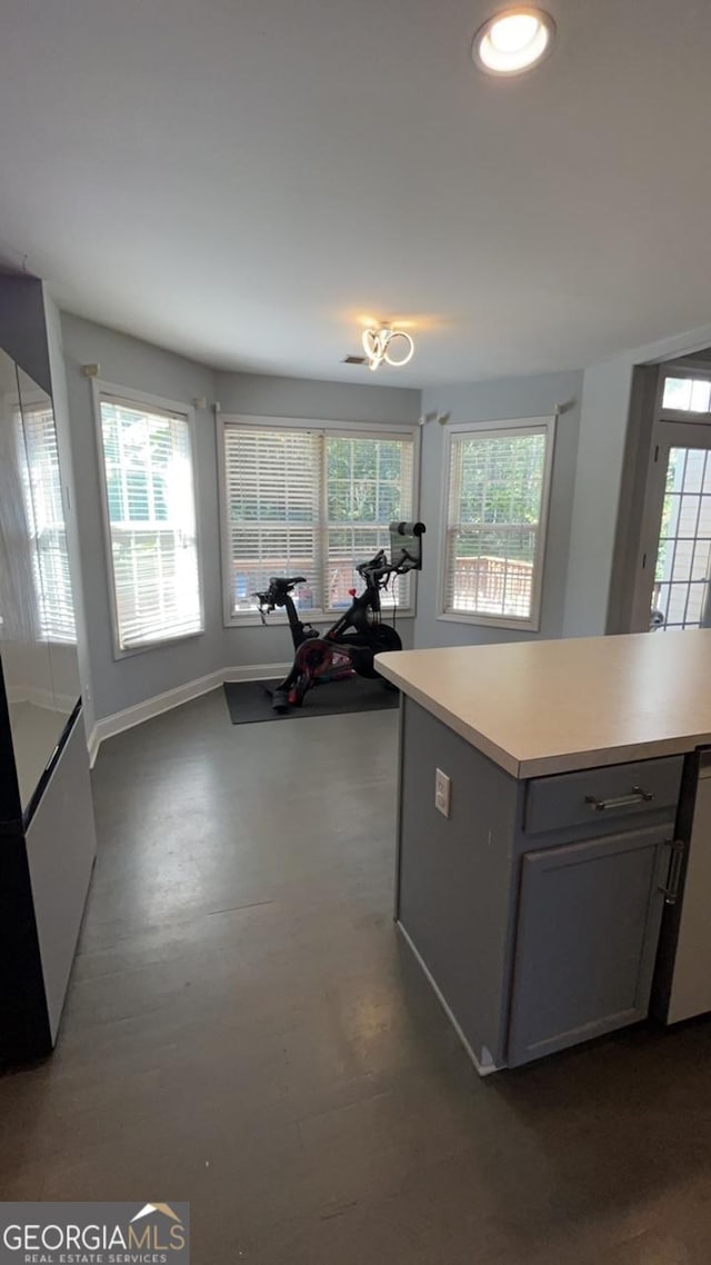 kitchen with gray cabinets, dishwasher, and a center island