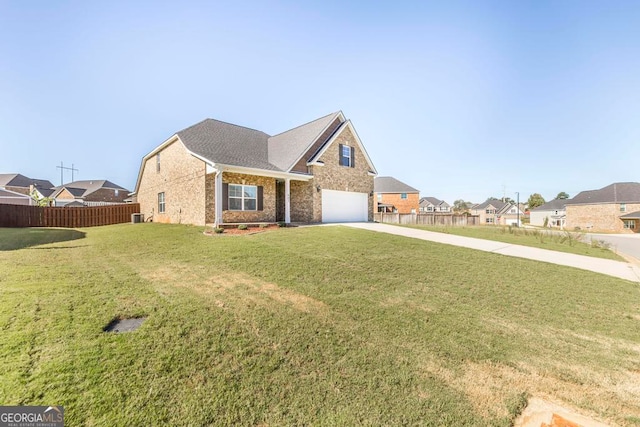 view of front facade with a front yard and a garage