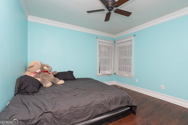 bedroom featuring ceiling fan, hardwood / wood-style flooring, and crown molding