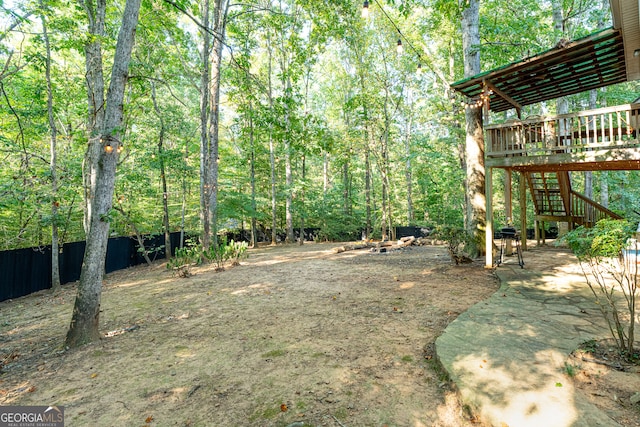 view of yard featuring a wooden deck