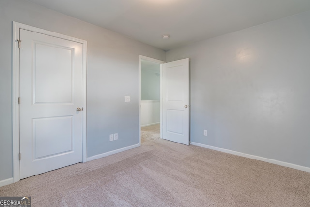 empty room with light colored carpet