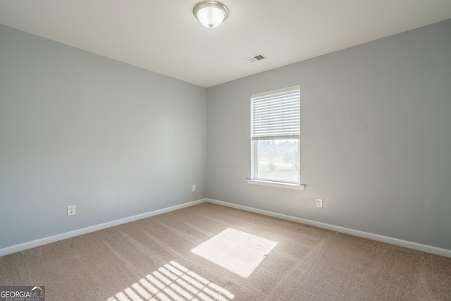 view of carpeted spare room