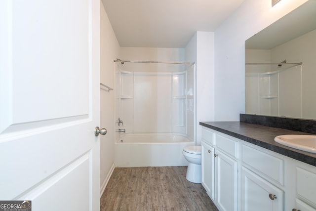 full bathroom featuring wood-type flooring, vanity, toilet, and shower / washtub combination