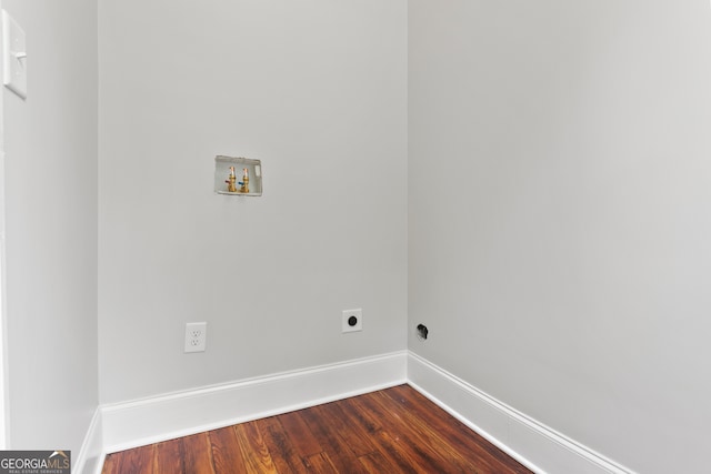 clothes washing area with washer hookup, dark wood-type flooring, and electric dryer hookup