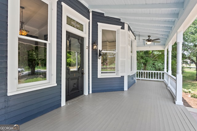 wooden deck with ceiling fan and covered porch