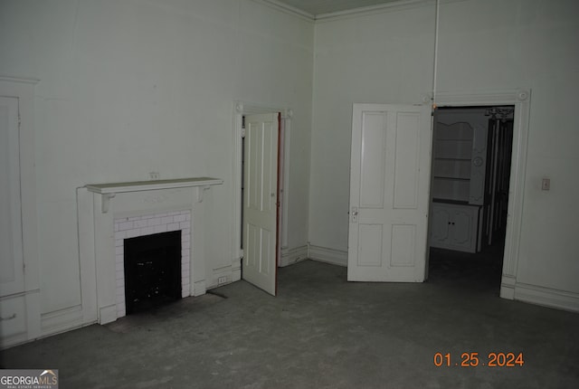 unfurnished living room with a brick fireplace