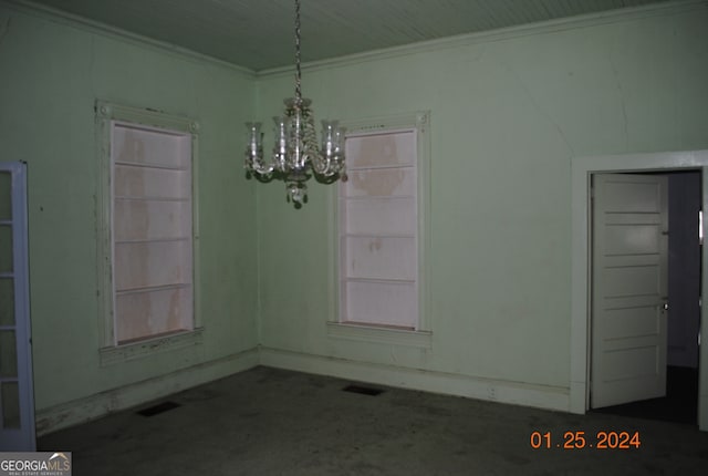 unfurnished dining area with crown molding