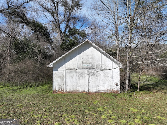 view of outdoor structure with a lawn