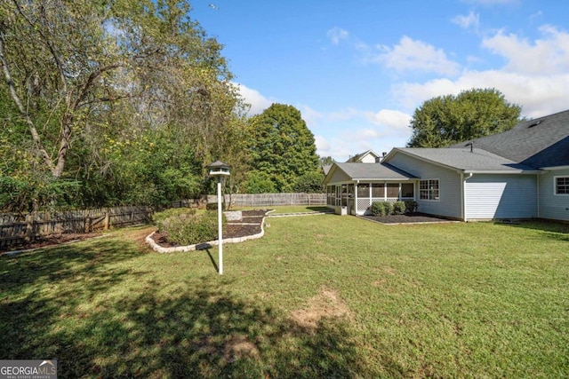 view of yard featuring a sunroom