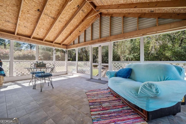 unfurnished sunroom with lofted ceiling