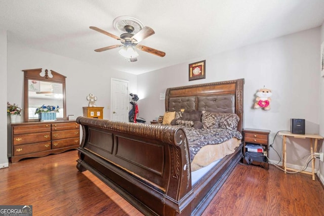 bedroom with ceiling fan and hardwood / wood-style floors