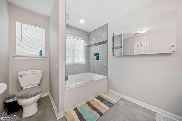 bathroom featuring tile patterned floors, toilet, and shower / tub combo with curtain