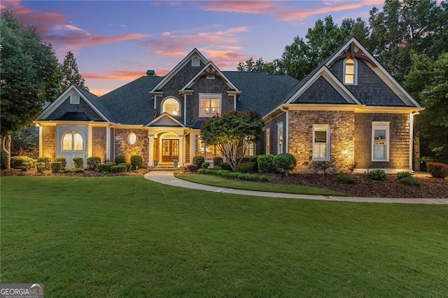 craftsman-style home featuring a yard