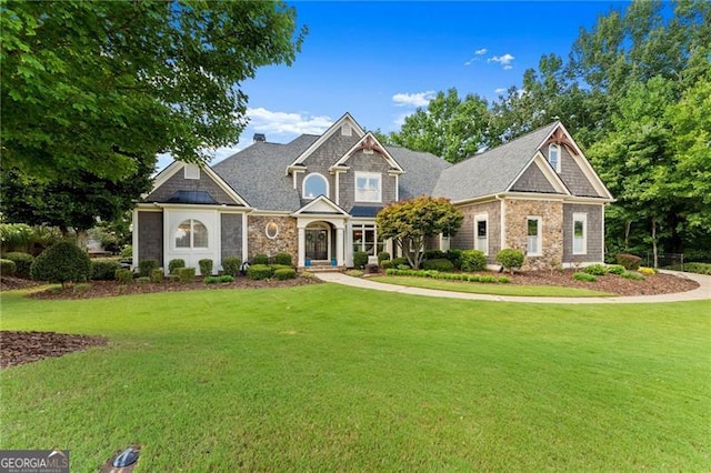 craftsman house with a front lawn