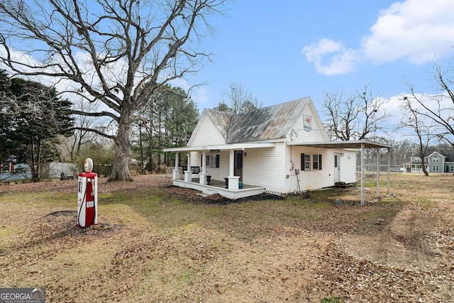 view of front of house with a front yard and a porch