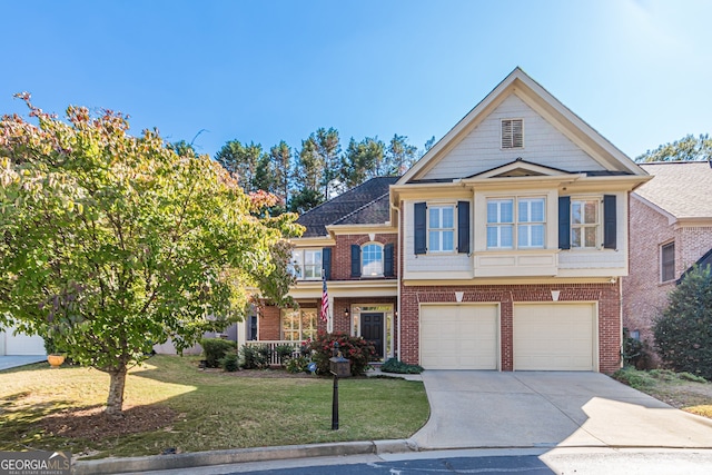 view of front of house featuring a front yard and a garage