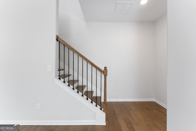 4060 Holstein Hl Unit 104, Columbus, GA 31904 - stairway featuring baseboards, wood finished floors, and visible vents