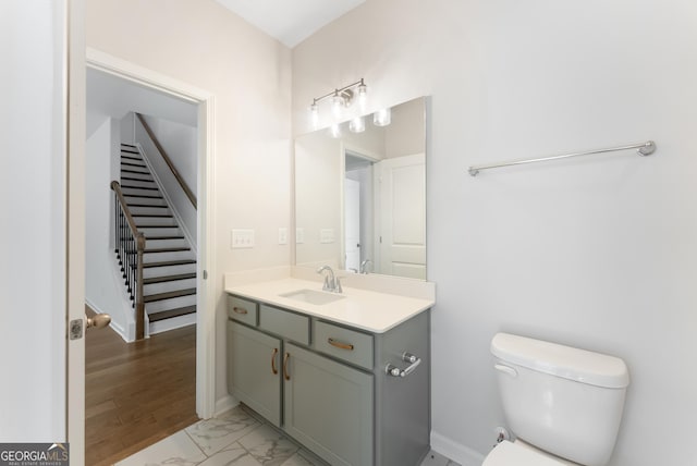 4060 Holstein Hl Unit 104, Columbus, GA 31904 - half bath featuring marble finish floor, baseboards, toilet, and vanity
