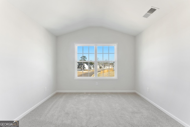 4060 Holstein Hl Unit 104, Columbus, GA 31904 - unfurnished room featuring vaulted ceiling, carpet flooring, visible vents, and baseboards