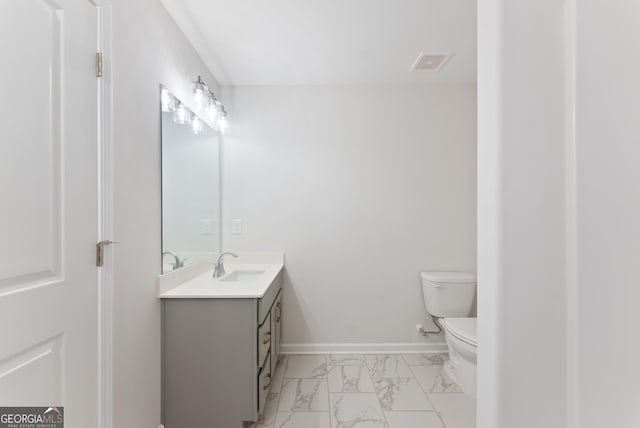 4060 Holstein Hl Unit 104, Columbus, GA 31904 - bathroom with marble finish floor, visible vents, toilet, vanity, and baseboards