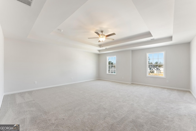 4060 Holstein Hl Unit 104, Columbus, GA 31904 - unfurnished room featuring baseboards, visible vents, a ceiling fan, carpet floors, and a raised ceiling