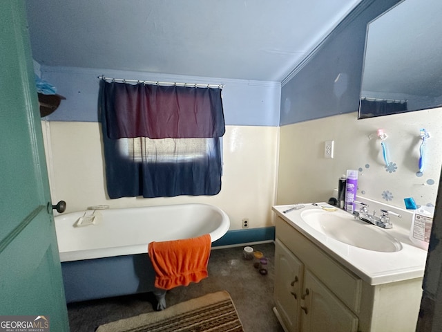 bathroom with vanity, crown molding, and a bath