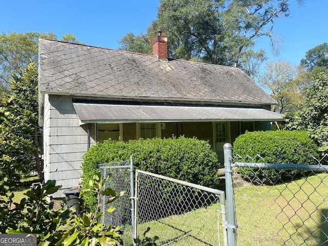 view of property exterior with a lawn