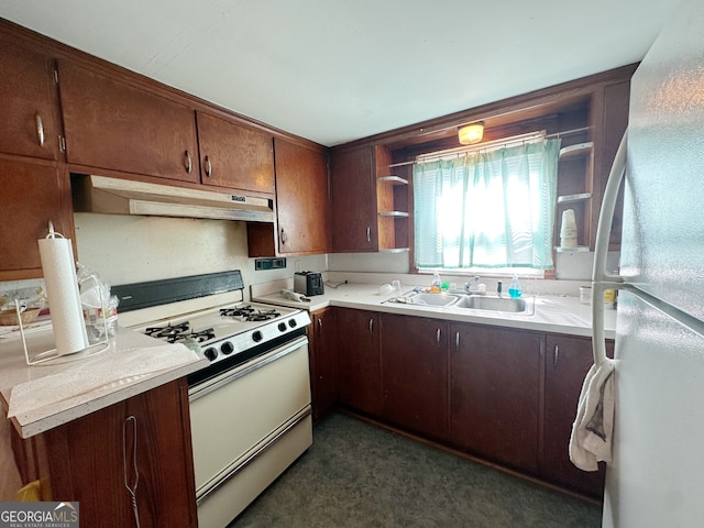 kitchen featuring white appliances and sink