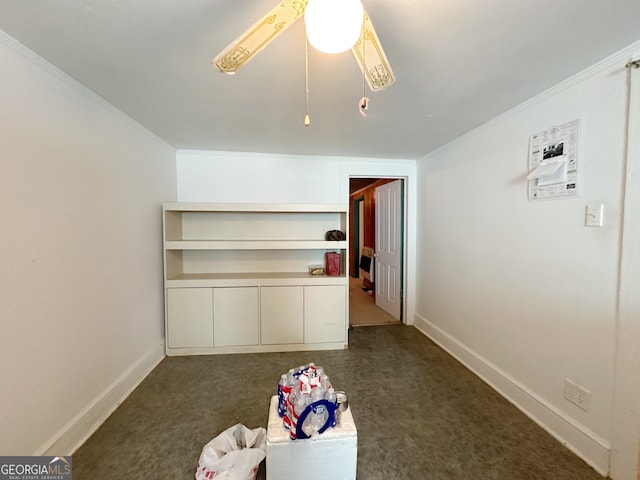 unfurnished bedroom featuring ornamental molding, dark carpet, and ceiling fan