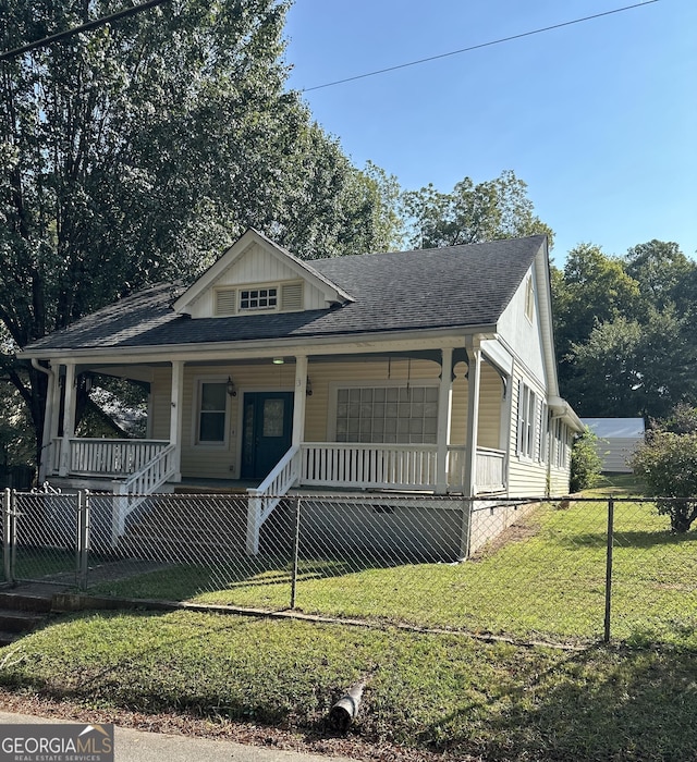 bungalow-style house with covered porch and a front yard