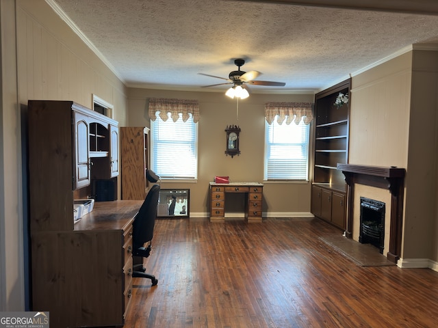 office space with crown molding, dark wood-type flooring, plenty of natural light, and ceiling fan