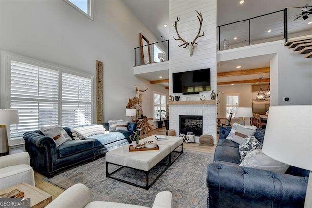 living room with plenty of natural light and a high ceiling