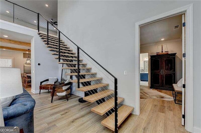 stairs featuring wood-type flooring