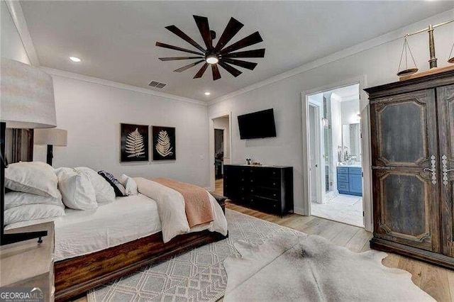 bedroom featuring ensuite bathroom, ceiling fan, crown molding, and light hardwood / wood-style flooring