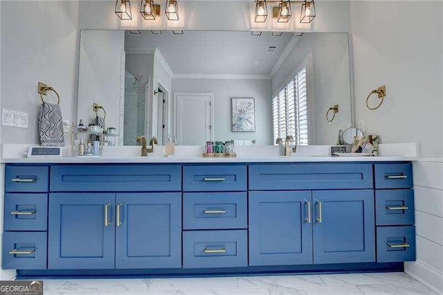 bathroom with vanity, a shower with door, and crown molding