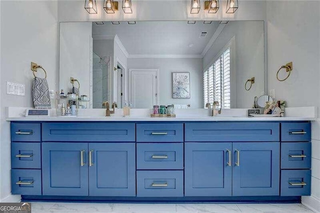 bathroom with vanity, a shower with shower door, and crown molding